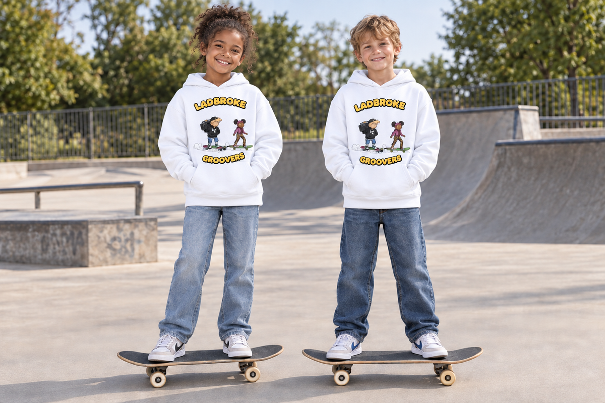 Children wearing white Ladbroke Groovers hoodies on skateboards