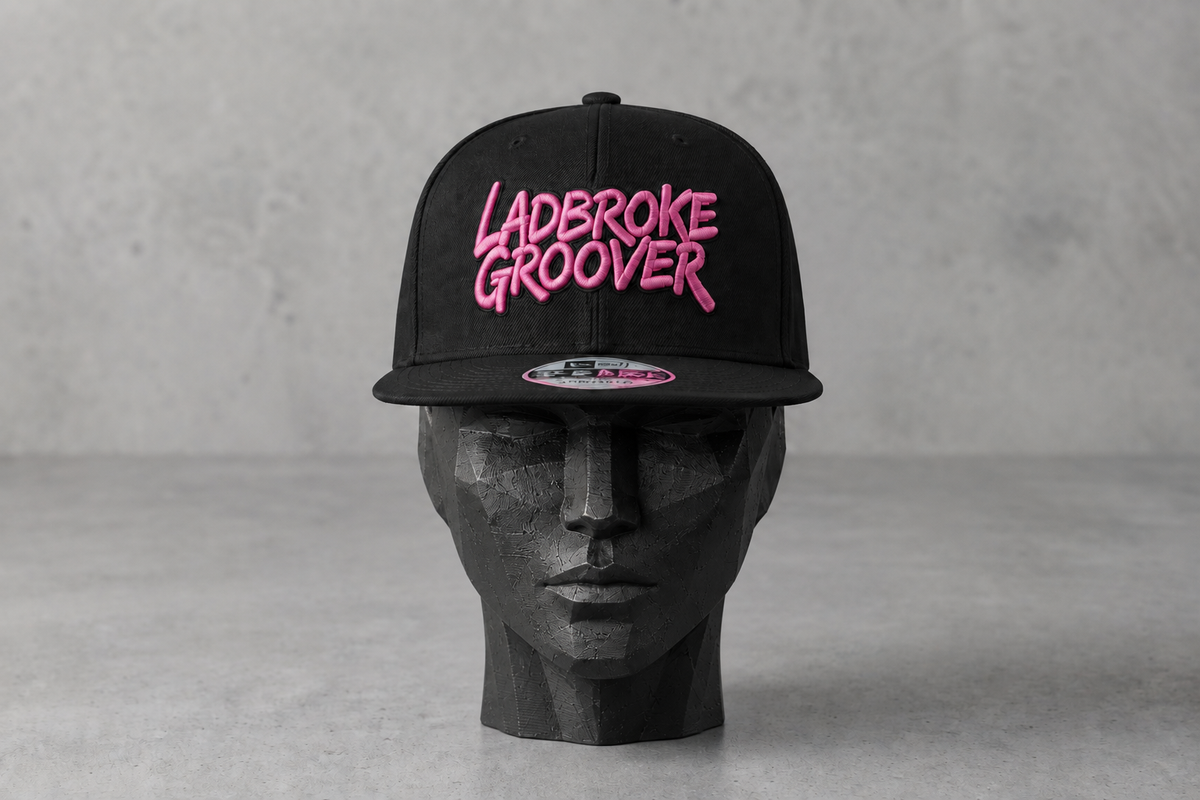 Pink-logo cap on a feminine wooden head block