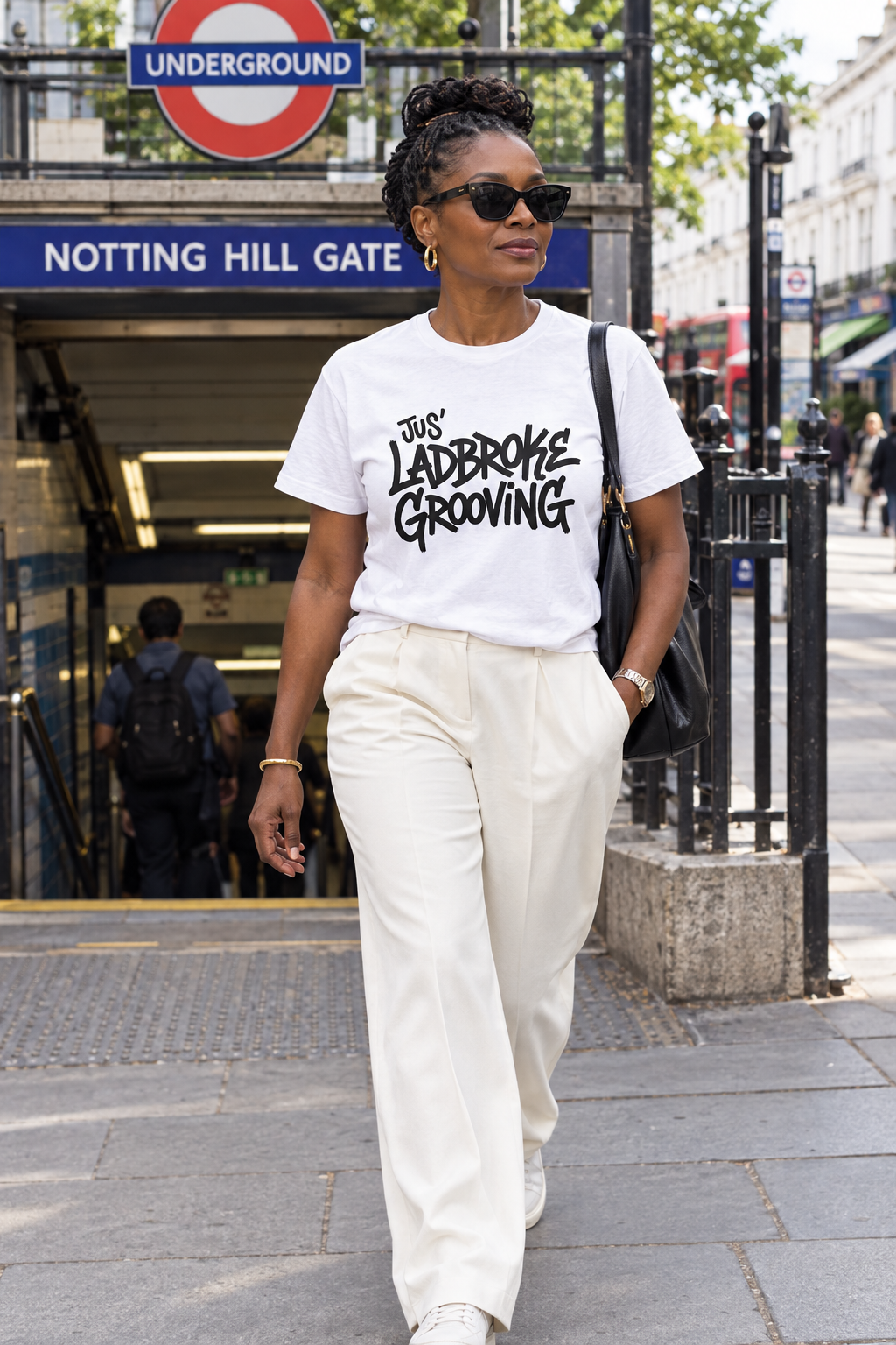 Black woman wearing the white T-shirt outside Notting Hill Gate station