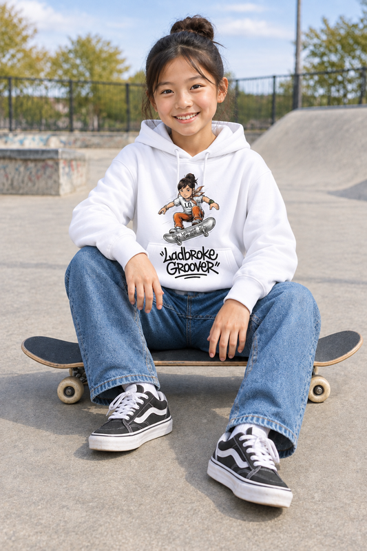 Girl wearing white hoodie sitting on skateboard