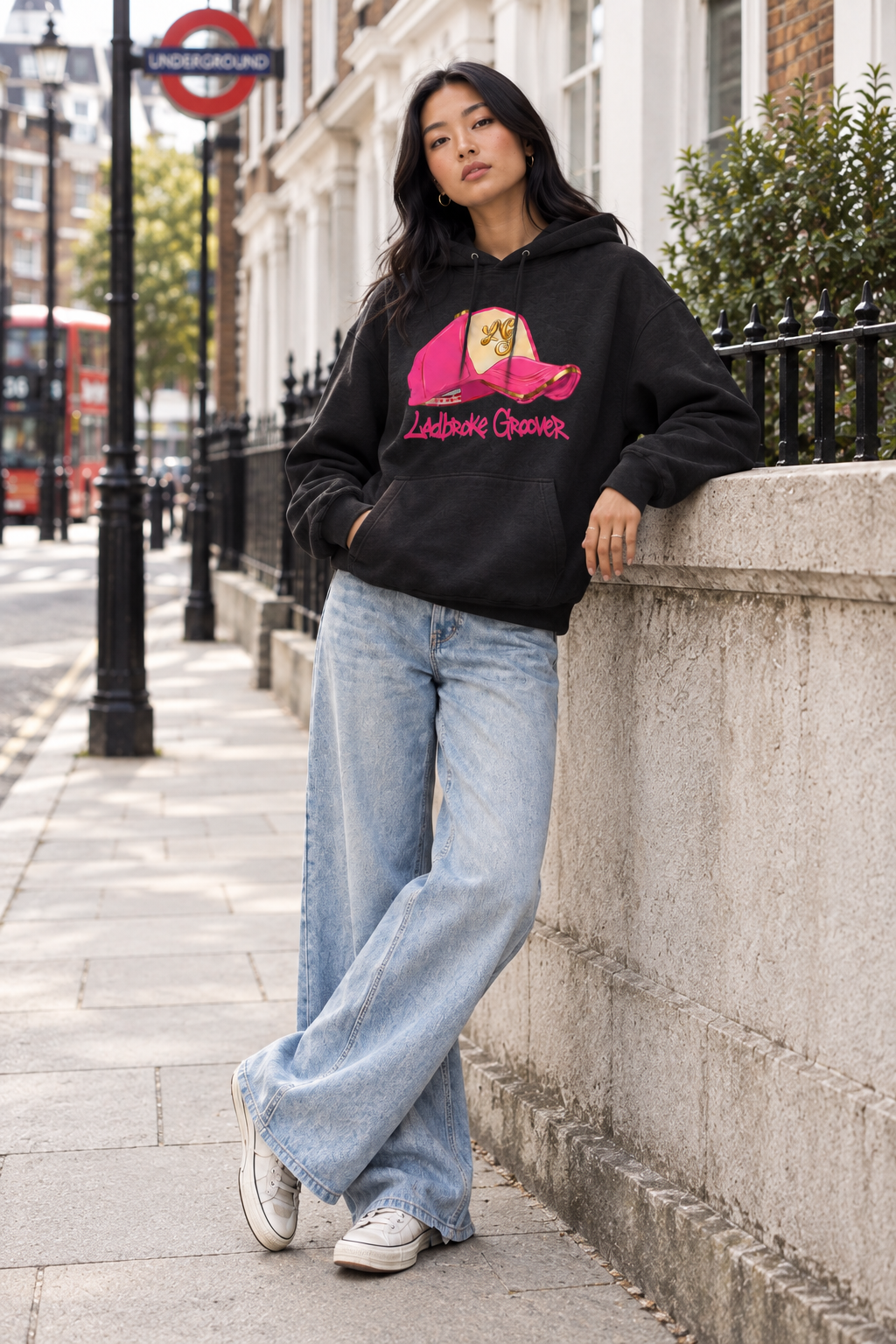AI-generated woman wearing a black pink-cap graphic hoodie with vintage jeans